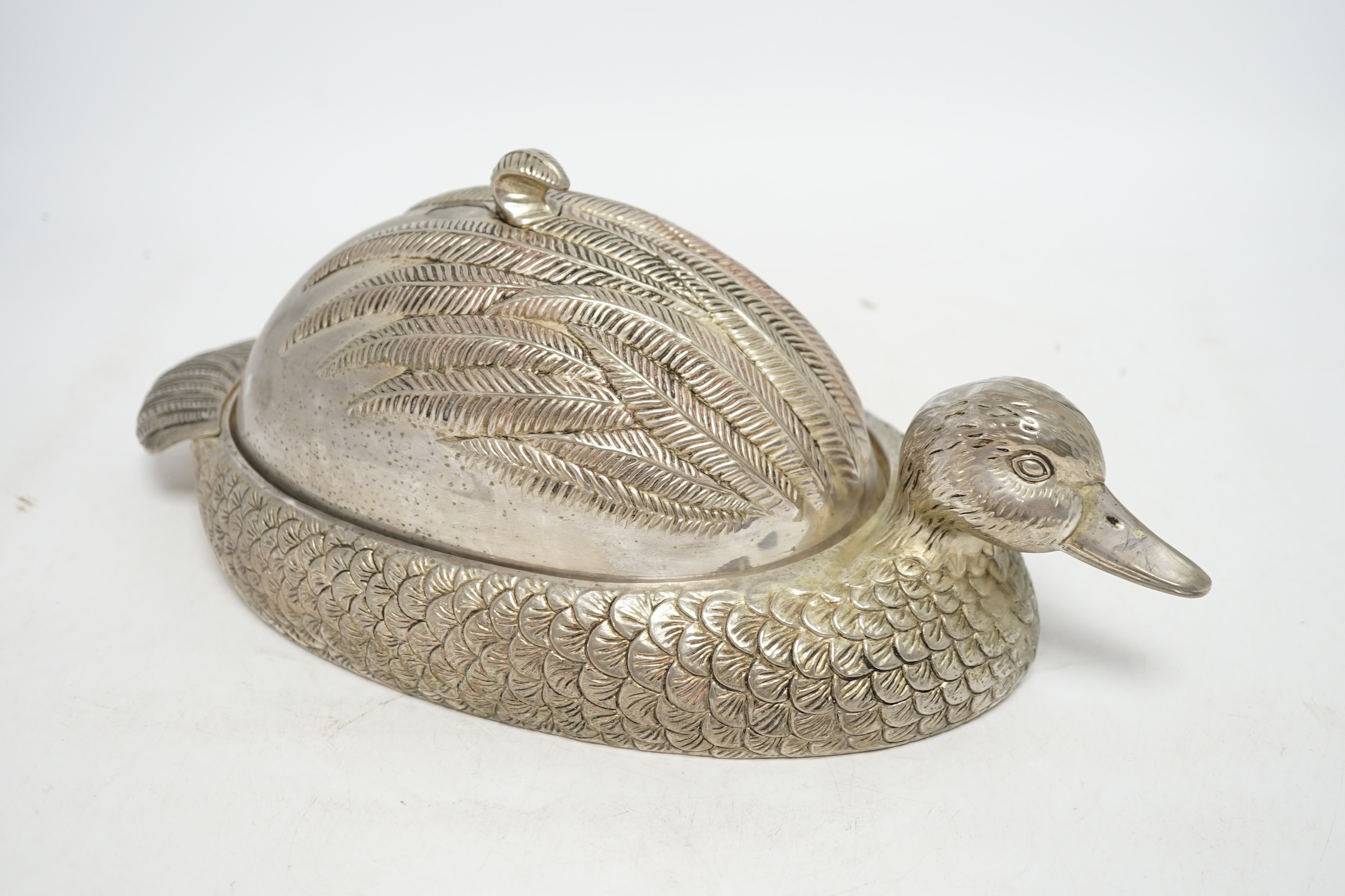 A novelty silver plated dish and cover, in the form of a duck, 37cm long. Condition - good